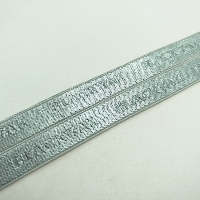 Debossed elastic webbing floded